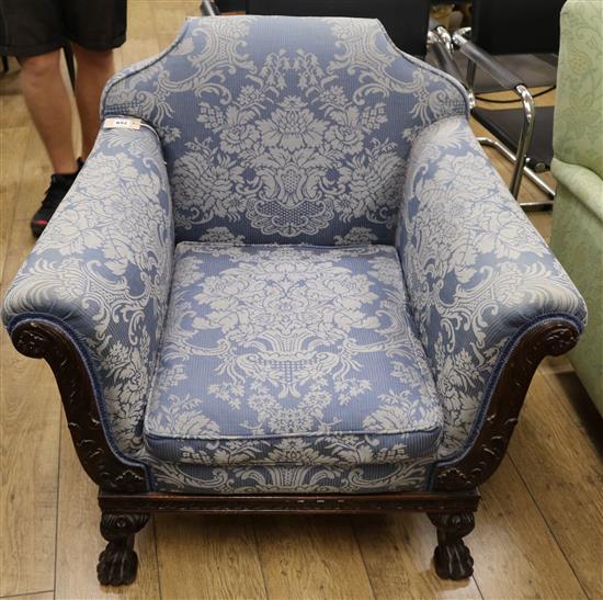 An upholstered bergere armchair